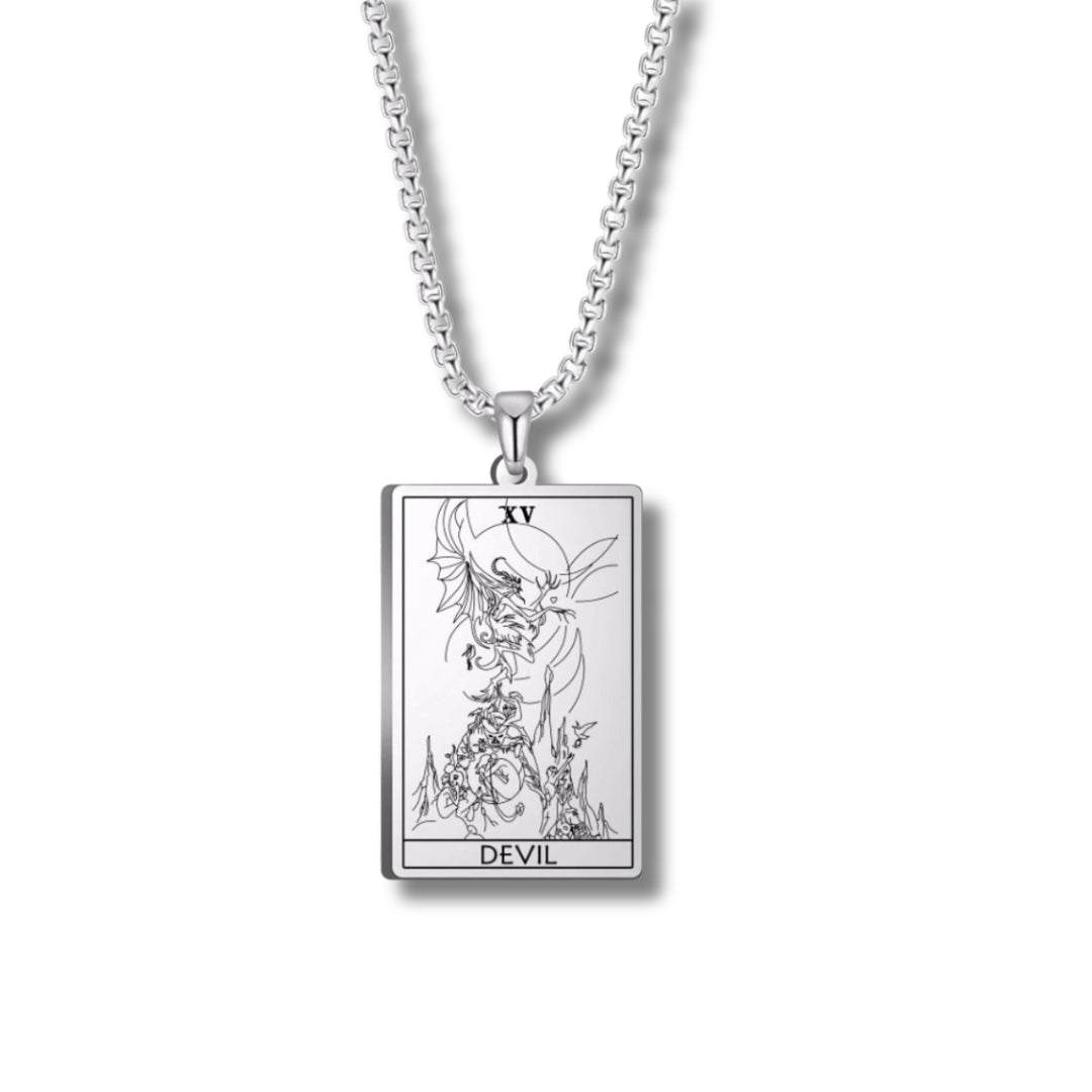 Silver necklace with a tarot card pendant on a white background