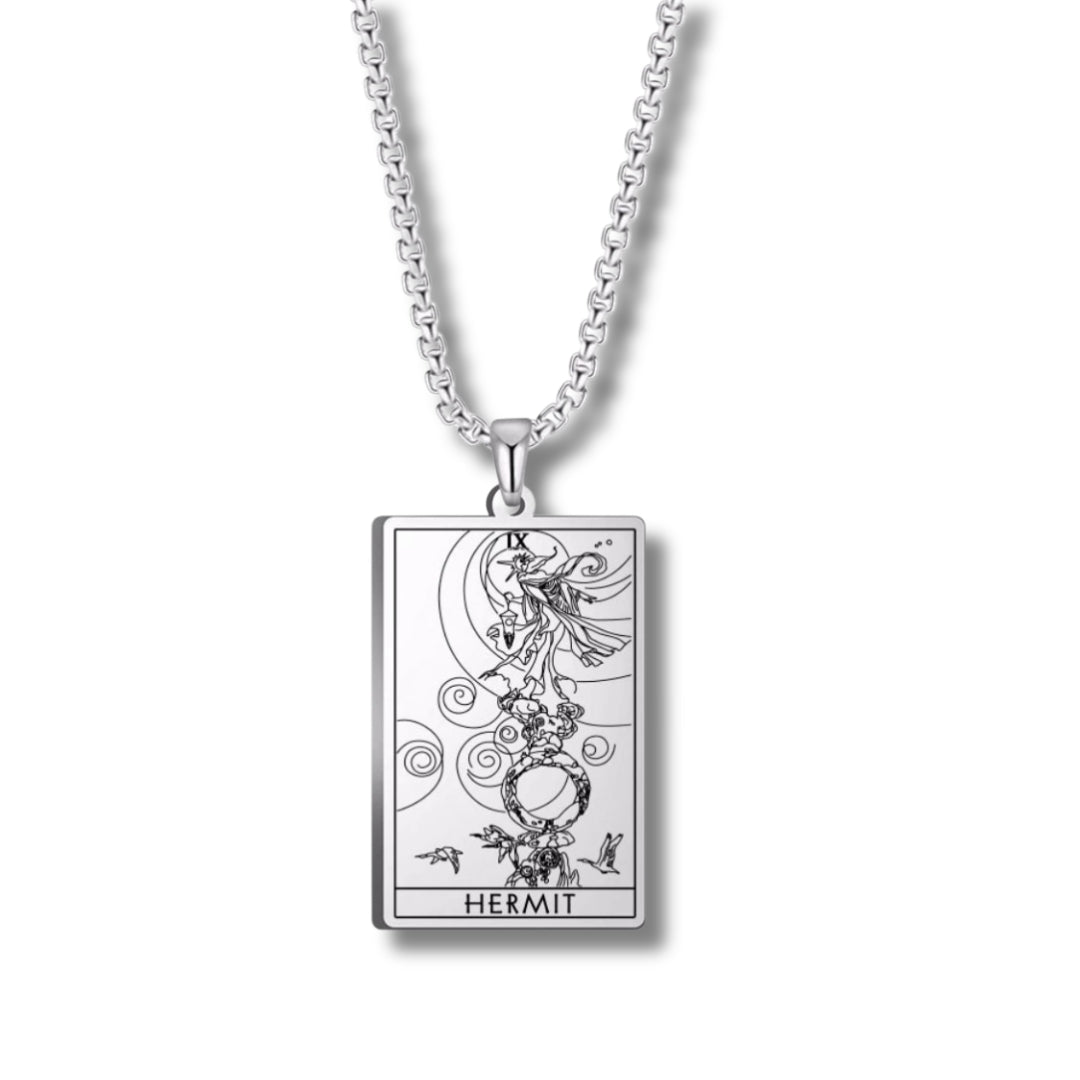 Silver necklace with a 'Hermit' tarot card pendant on a white background