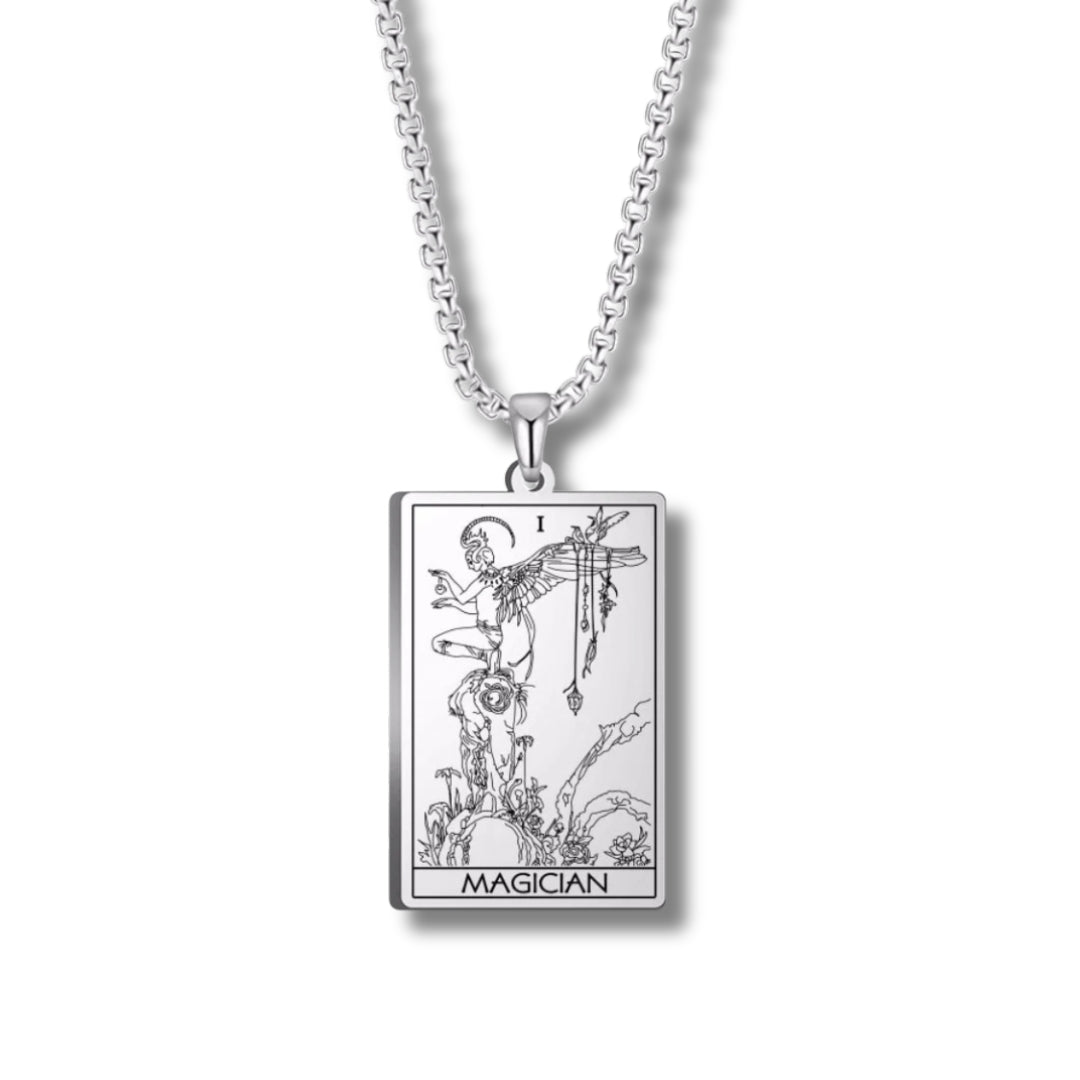 Silver Tarot card pendant with 'Magician' design on a white background
